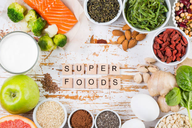istock Selection of superfoods on rustic background 897360796