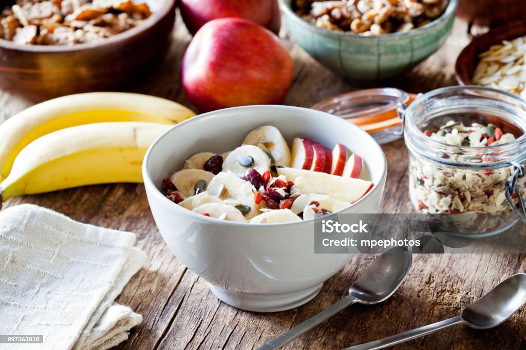 Healthy Yogurt With Cereal And Fruits Bowl of yogurt with fruits and cereal for breakfast Almond Stock Photo