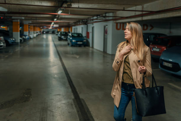istock Businesswoman in underground garage 897370296