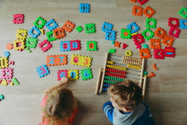 istock little boy and girl learn to calculate numbers 897371992