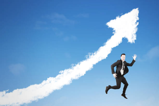 istock American businessman jumping with upward arrow 897372038