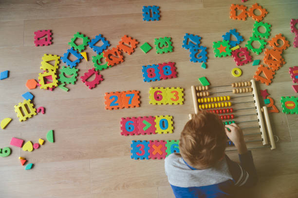 istock little boy learn to calculate numbers 897372106
