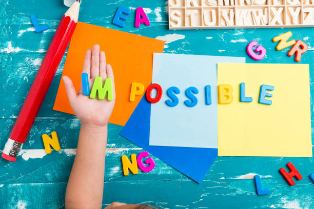 istock Children play plastic letters to combinations word 