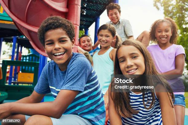 Playground And Friends Fun Guaranteed Stock Photo - Download Image Now - Child, Playground, Multiracial Group