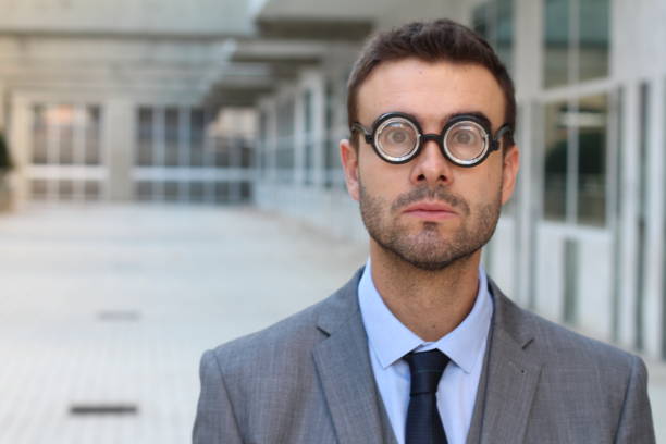 istock Foolish geek looking stunned in the office 897386146