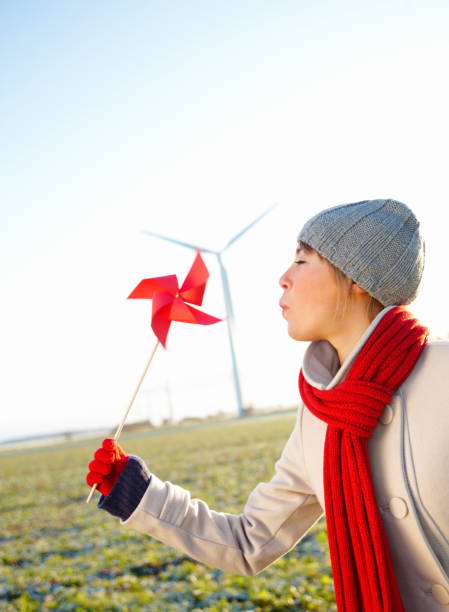 istock Young girl blowing at her paper hand mill 89738645