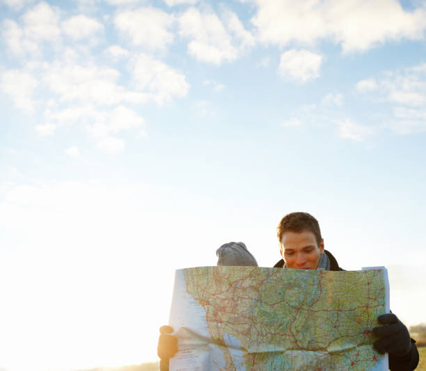 istock Portrait image of young couple reading map 89738667