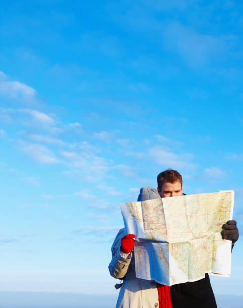 istock Portrait of young couple going through a map 89738671
