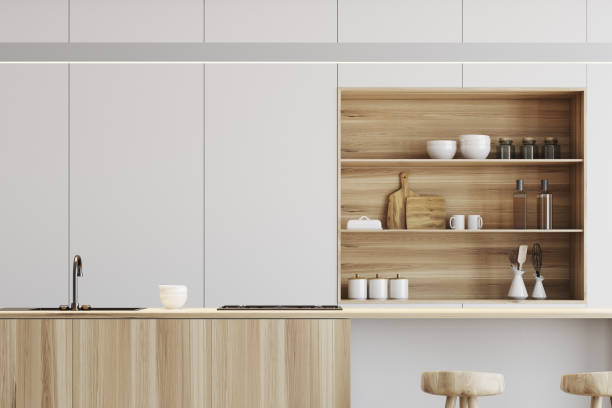 istock White kitchen, wooden bar stand close up 897391162