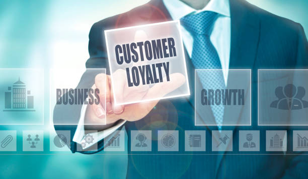 Customer Loyalty Concept A businessman pressing a Customer Loyalty button on a transparent screen. loyalty stock pictures, royalty-free photos & images