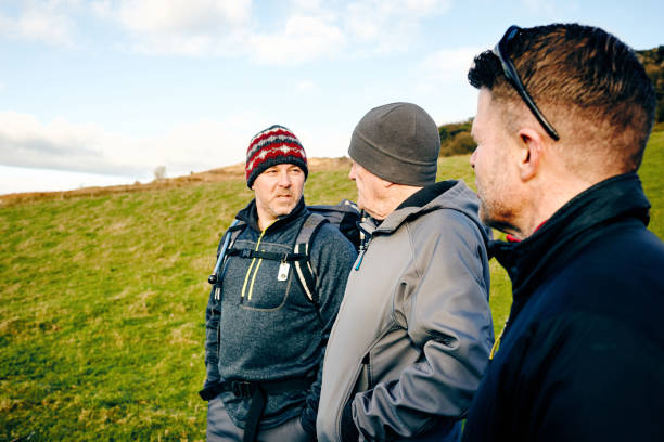 istock Mature friends hiking in countryside 897410310