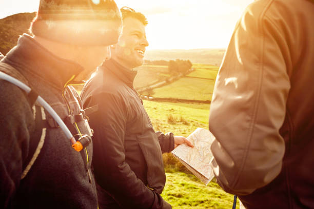 istock Hikers discussing over directions while trekking in the hills 897410328