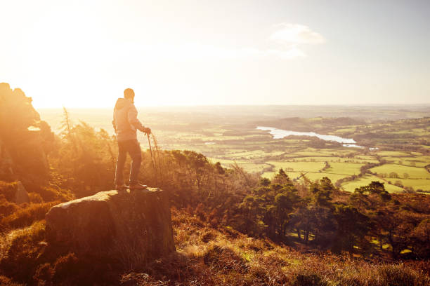 istock Hiker at the top of a rock 897410384