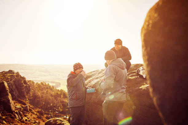 istock Mature people having a rest at top of mountain 897410406