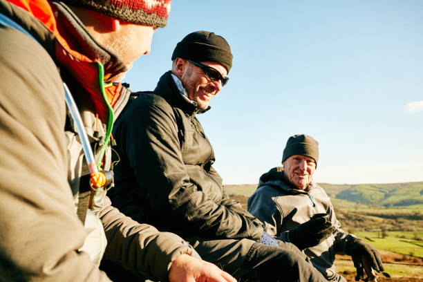 istock Mature man resting while hiking in countryside 897410446