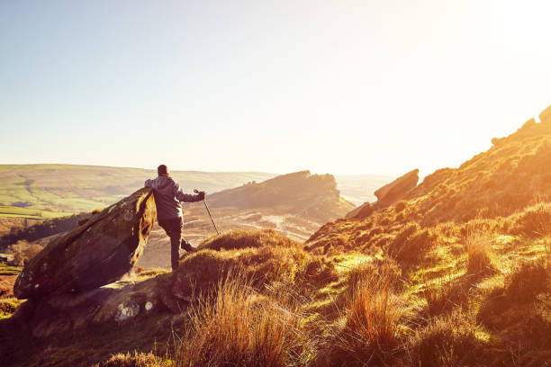 istock Male hiker relaxing on a mountain with great view while hiking 897410484
