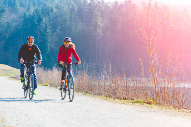 istock Couple Cycling Through Countryside Together 897424052