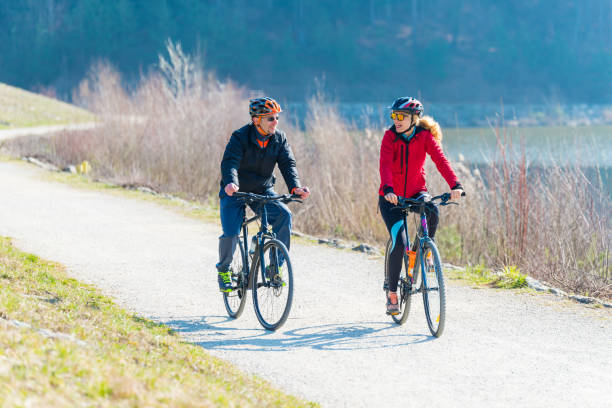 istock Couple Cycling Through Countryside Together 897424056