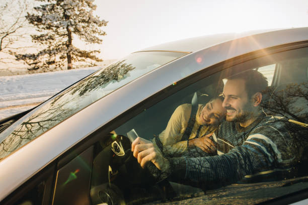 istock Young loving couple going on a road trip during winter day. 897428920