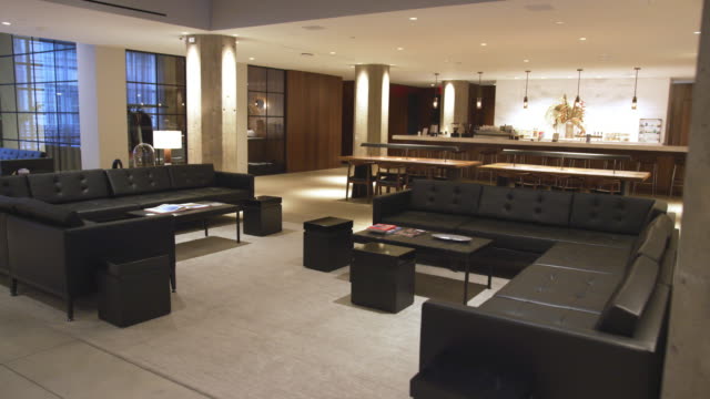 Sofas and coffee tables in empty business lounge interior