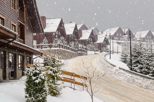 Beautiful scene of winter ski resort living residence  during snowfall