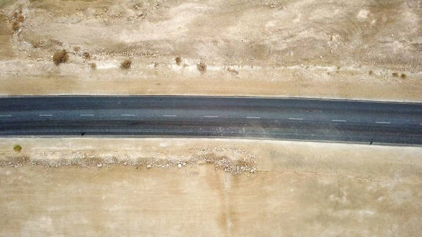 istock Desert road - Aerial image 897432694