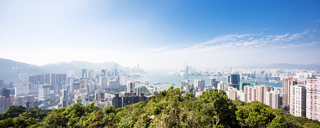 cityscape of hong kong in blue cloud sky from hill