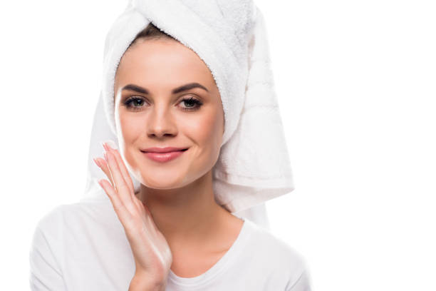 istock girl applying cream on face 897446866