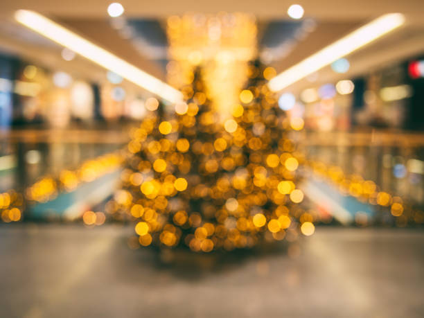 christmas and new year decorated blurred interior background - christmas shopping imagens e fotografias de stock