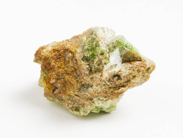 istock Ore green tourmaline on white background 897447750