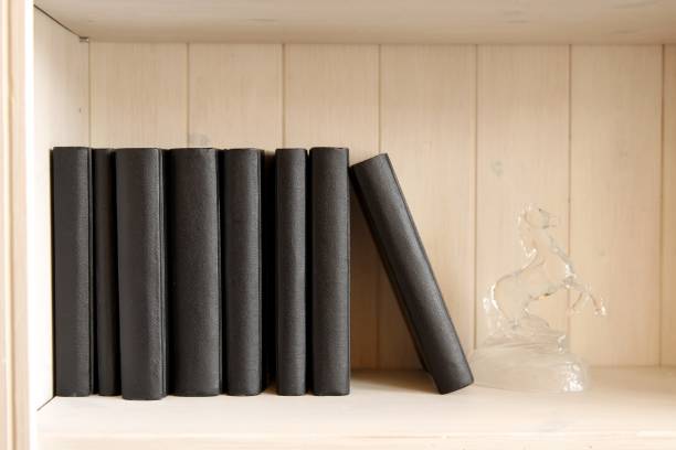 istock Vintage books on the shelf and a vase 897450704