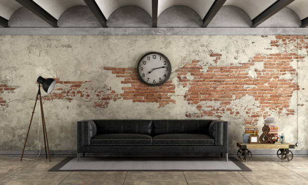istock Black sofa in a grunge room 897451216