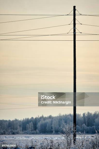 Post Pole Pillar Transmission Facilities In Winter Sunset Stock Photo - Download Image Now