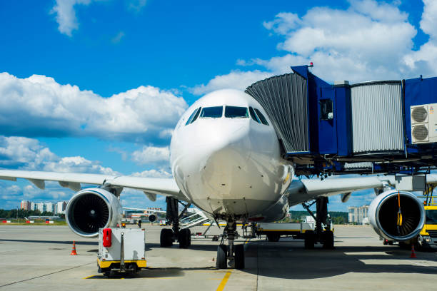 istock Modern white passenger airplane standing on parking place and get ready for boarding passengers in international airport Vnukovo 897455258