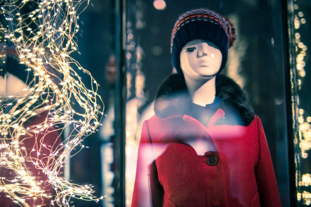 Christmas lights and mannequin in clothing store. No people. Cracov in Poland.