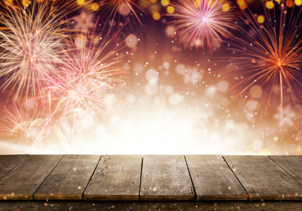 Abstract colored firework background with empty wooden planks, free space for product placement. Celebration, success, new year and anniversary concept