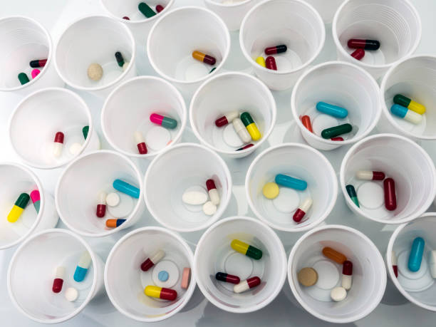Daily medication at a hospital table, conceptual image stock photo
