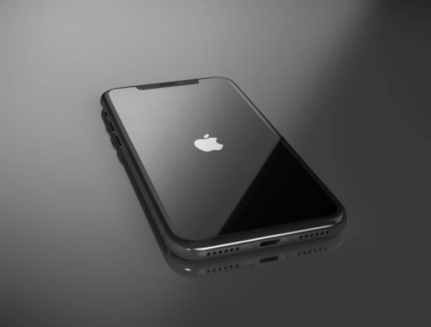 Kiev, Ukraine - December 20, 2017: 3D Render of a black iPhone X with Apple Inc logo on the reflecting surface. Editorial image with clipping path