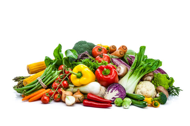 istock Healthy fresh vegetables heap isolated on white background 897478458