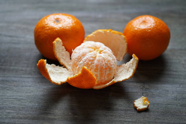 istock clementines or mandarin oranges on rustic wooden table 897487704