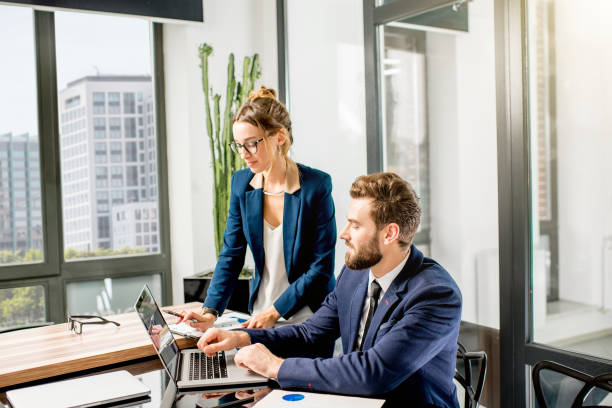 istock Couple of managers working at the office 897487950
