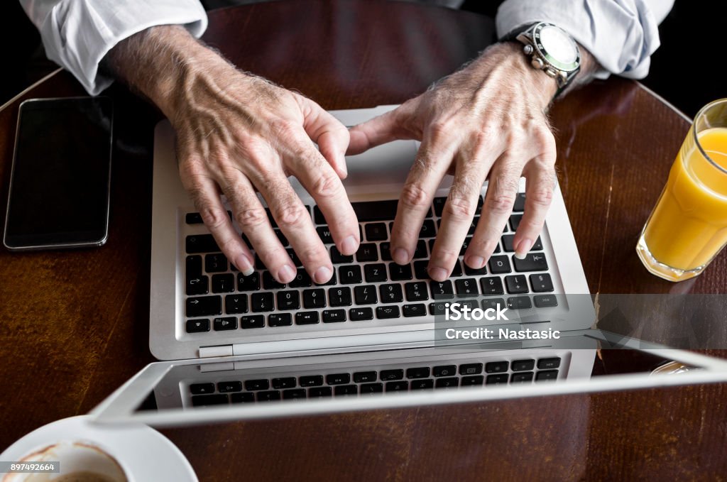 Man Using Keyboard Man Using Keyboard On Laptop Computer Stock Photo - Download Image Now ...