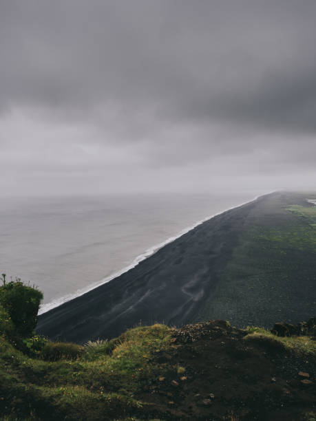 istock scenic view of black sand beach from cliff, Vik, Iceland 897496568