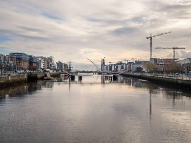 Modern buildings on Liffey river in Dublin and Harp bridge. This image is GPS tagged
