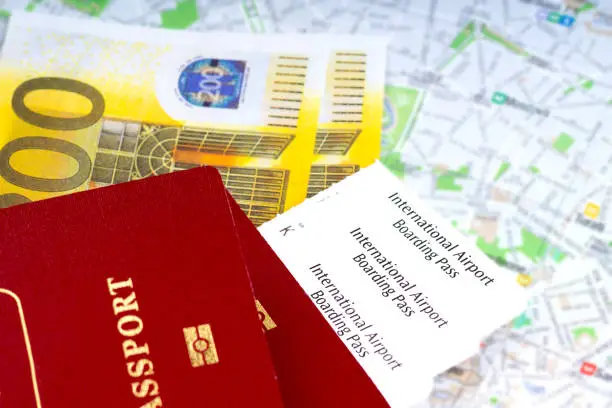 passport, boarding pass and money over map. travel concept.