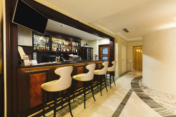 istock Hotel lounge bar with bottle shelfs and seats 897498558