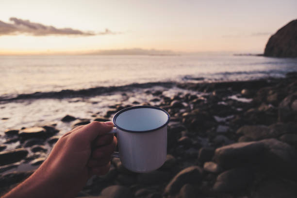 istock cup of tea at sunset 897504090