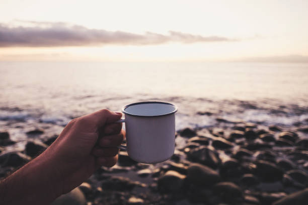 istock cup of tea at sunset 897504180