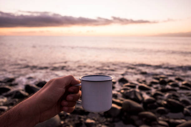 istock cup of tea at sunset 897504224