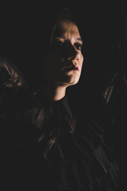istock Sad woman on black backround 897504226